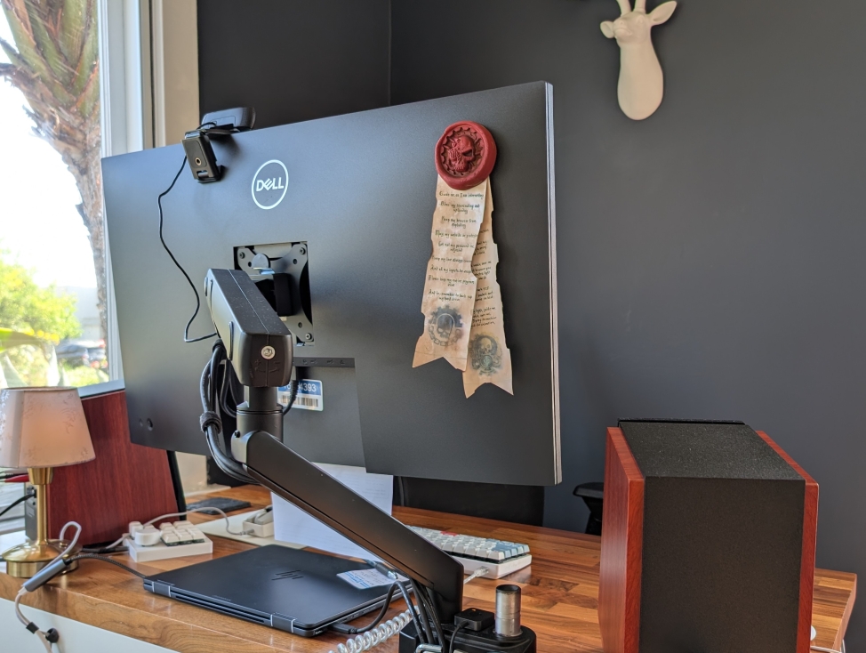 Adeptus Mechanicus purity seal stapled to a monitor.